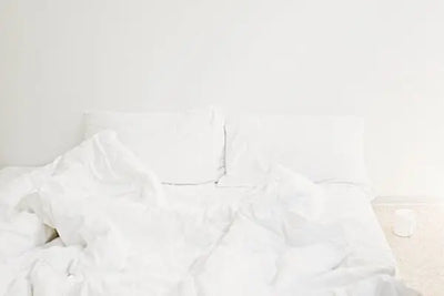 Pillows that were grown and sewn in America sit in a bed waiting to give a perfect night sleep. 
