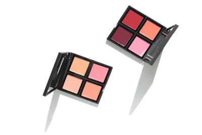 Two containers of American made blushes, with colors ranging from wine red to light pink. 