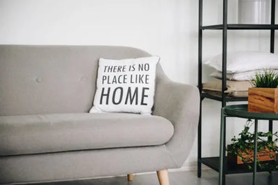 House decor, pillows and a grey pillow all bring this space to life. Each piece of decor and furniture piece were made in America. 