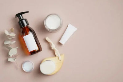 A bottle of American made pomade and creme sit on a table to be used for textured and regular hair types. 