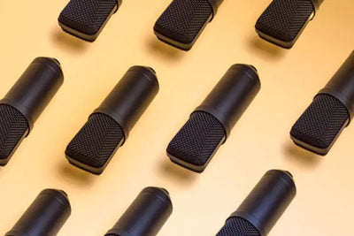 Multiple black microphones.