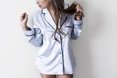 A woman stands proud wearing her American made nightgown. She can sleep well at night knowing the nightgown was made with craftmanship and care.