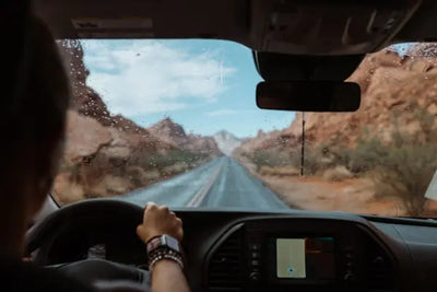 A car driving through mountains.