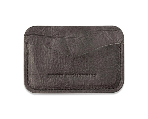 The Bison Card Case by Rogue Industries is crafted from dark brown American Bison leather, features two slots, and is embossed with the brands name on the front. Made in Maine, its shown against a white background.