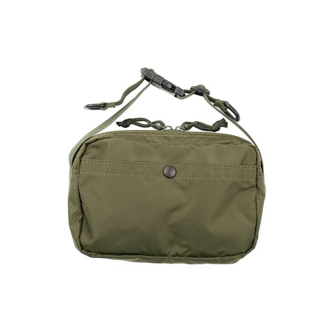 The MIS AW Shoulder Bag S in olive is a water-resistant, USA-made shoulder bag with a zippered pouch, snap-button front pocket, and an adjustable strap with black plastic buckle, shown against a white background.