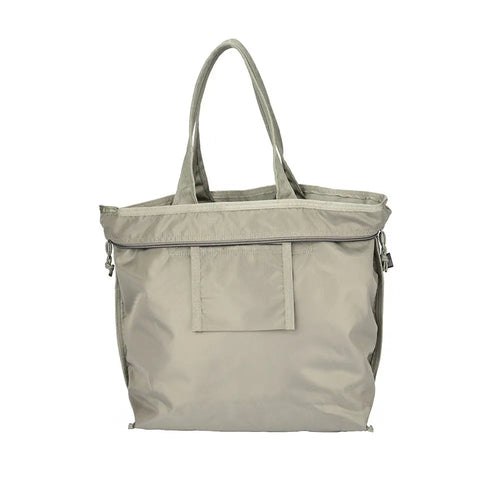 The MIS Tote Bag in Coyote Brown is a water-resistant Cordura Nylon tote with two handles, front pocket, and heavy-duty zipper top, photographed against a plain white background.