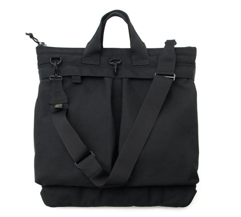The MIS Flyers Helmet Bag With Alice Strap - Black is a water-resistant Cordura Nylon bag with two short handles, a durable shoulder strap, zippered top closure, and a minimalist rectangular design.
