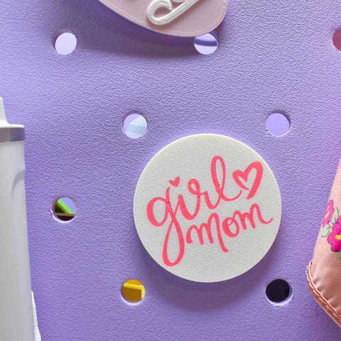 The Chatelet Manufacturing FRESHe BOGLETS Girl Mom Charm in pink and white is a decorative accessory with heart detail, perfect for personalizing your Bogg Bag.
