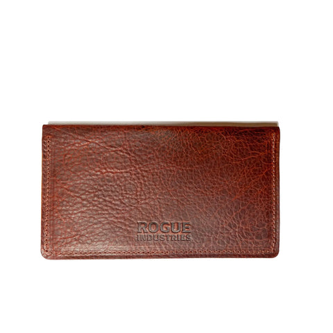 A brown Leather Checkbook Cover by Rogue Industries is shown against a white background, featuring textured American Bison leather, visible edge stitching, and classic Maine craftsmanship.