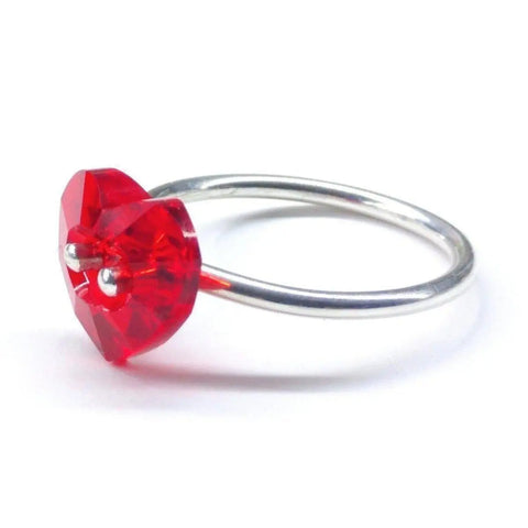 The I Love You Crystal Heart Bling Ring by Alexa Martha Designs showcases a vibrant red, heart-shaped Swarovski crystal on a sterling silver band—an ideal Valentines Day gift, shown against a white background.