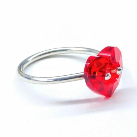 The I Love You Crystal Heart Bling Ring by Alexa Martha Designs is a sterling silver ring with a faceted heart-shaped red gemstone secured by two prongs—perfect for Valentines Day.