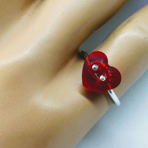 A mannequin hand displays the Alexa Martha Designs I Love You Crystal Heart Bling Ring, a sterling silver piece with a red heart charm, rhinestone eyes, and a smile—an adorable Valentines Day gift.