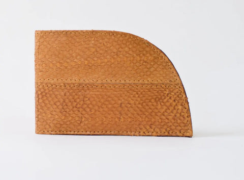 The Rogue Industries Rogue Front Pocket Wallet in textured salmon leather features a unique semi-circular design and is displayed standing upright against a plain white background.