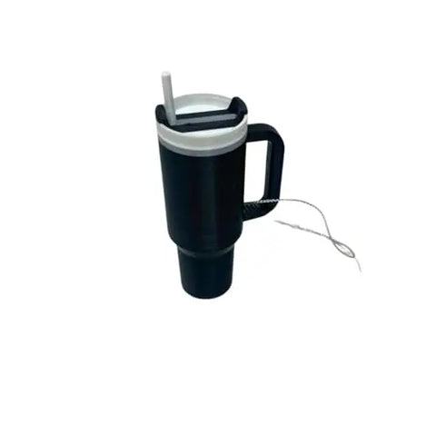 The Chatelet Manufacturing Tumbler Cup Replica Christmas Ornament is a large black mug with a handle, white lid, straw, and stirring stick—perfect for unique 2023 holiday tree decor. Made in the USA. Isolated on white background.