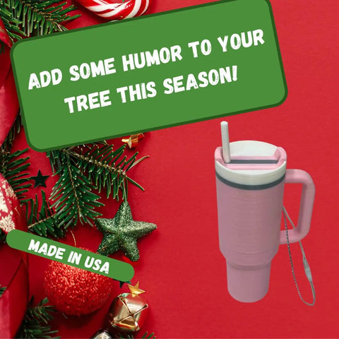 A festive flat lay with pine branches and Christmas decor on red, featuring “Add some humor to your tree this season!” above the Chatelet Manufacturing Tumbler Cup Replica Christmas Ornament. Made in USA.