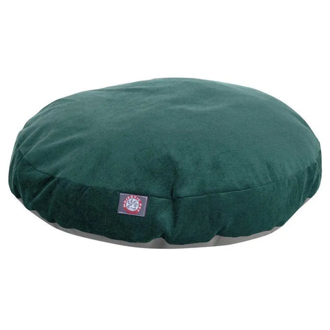 The Majestic Pet Villa Round Dog Bed features a soft, velvety dark green cover with a small rectangular logo tag, is washable and removable for easy cleaning, and is shown on a plain white background.