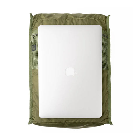 A silver Apple laptop sits on an olive green zippered pouch with mesh pockets, displayed on a white background—the ideal companion for your MIS Woodland Camo backpack, made in the USA with a padded laptop holder.